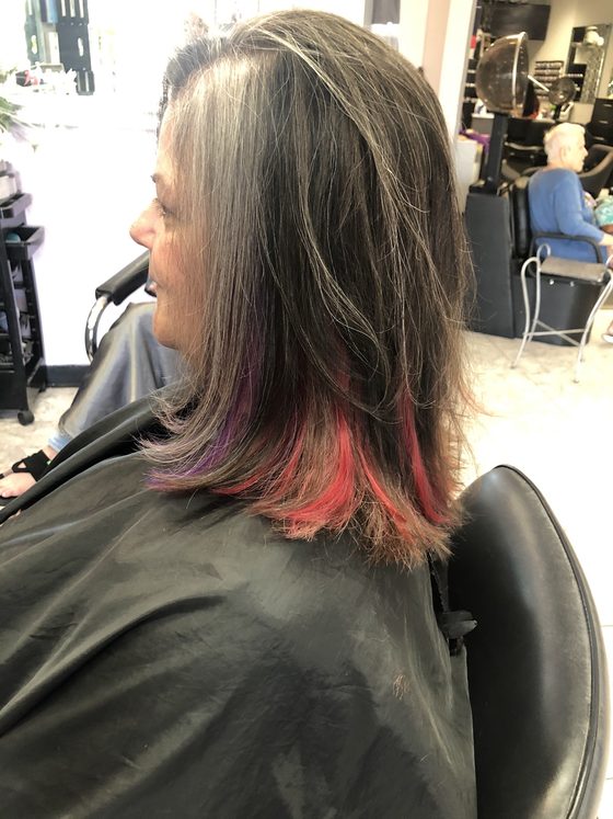 Brunette bob with magenta and coral ends, done at Envy Salon